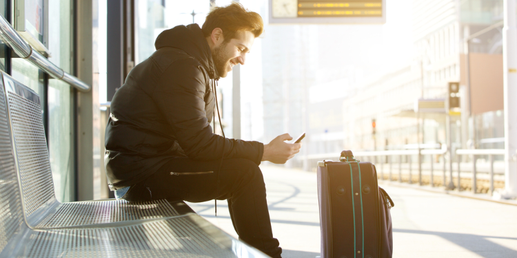 young man waiting for train