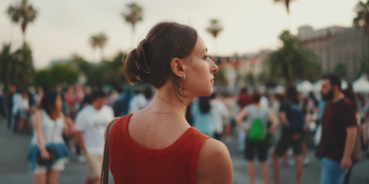 young woman looking at the crowd