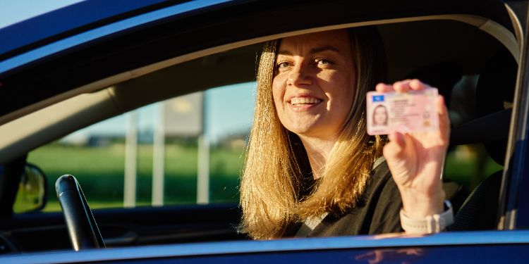 woman holding a driver's license