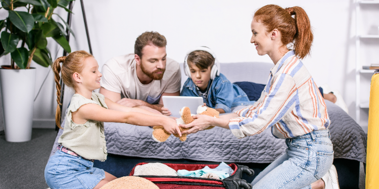 family packing suitcase