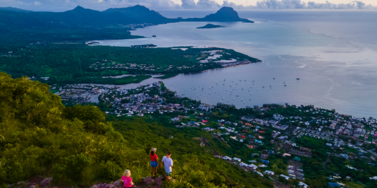 man and womant at the top of a mountain