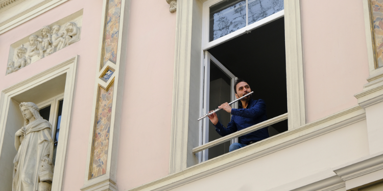 Flutist plays from his balcony during lockdown in Brussels