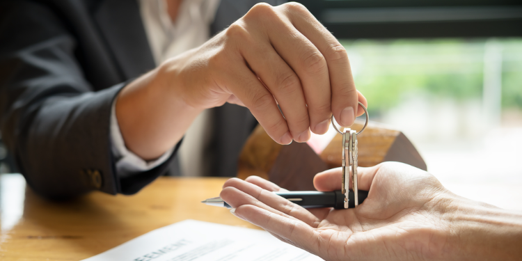 owner handing keeps to renter