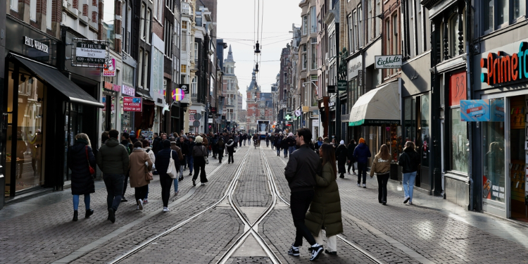 people walking in the streets of Amsterdam
