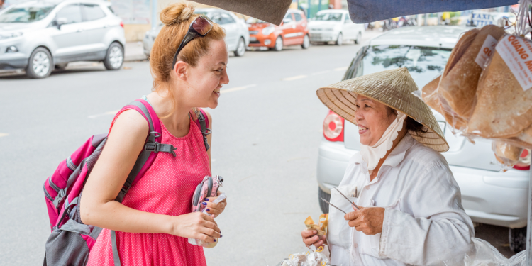 foreigner woman talking to a local
