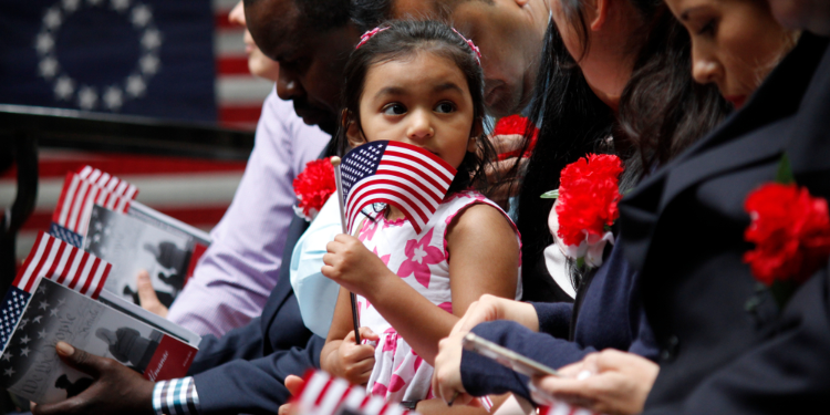 child holding US flag