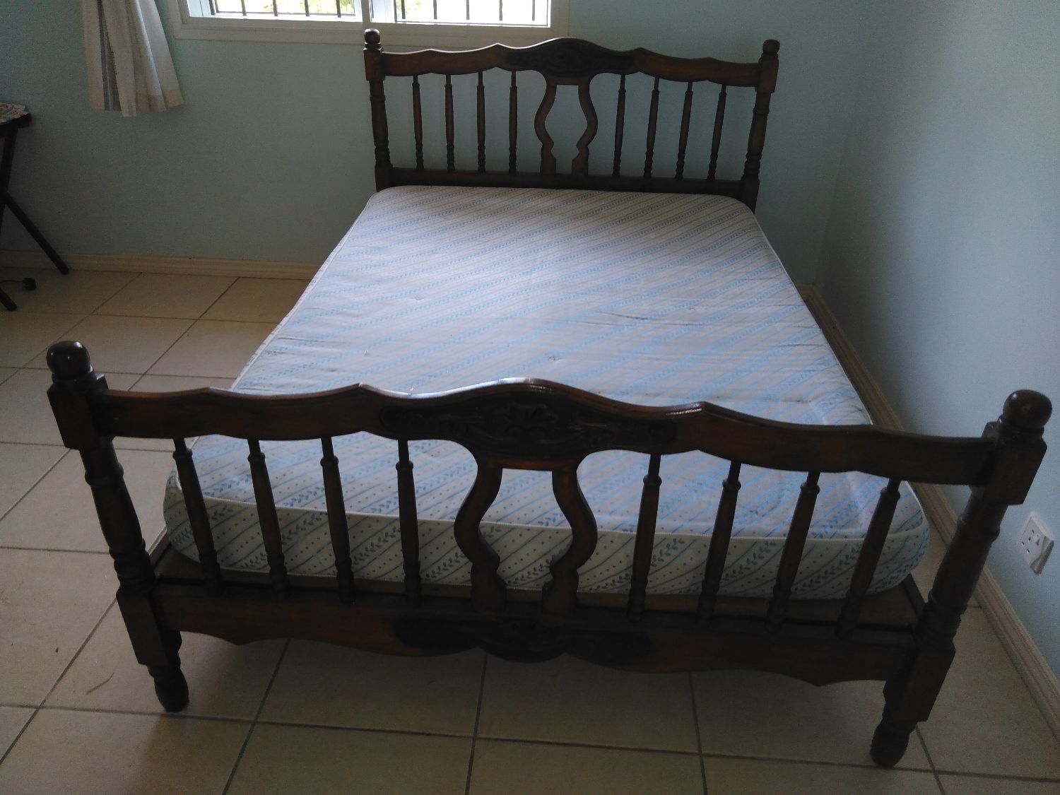 Bed with wood head and foot board, furniture Cap Malheureux in
