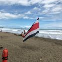 Costa Rica flag on beach