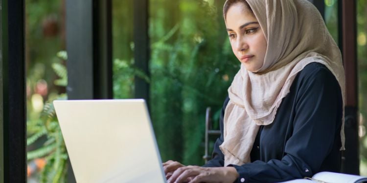 young lady using laptop