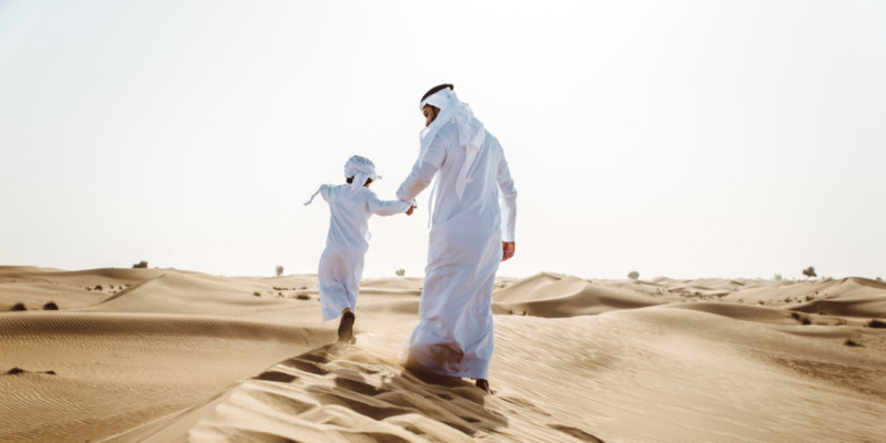 father and son in the desert