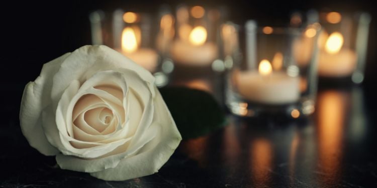 white flower and candles for mourning