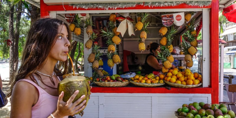 young woman drinking coconut water