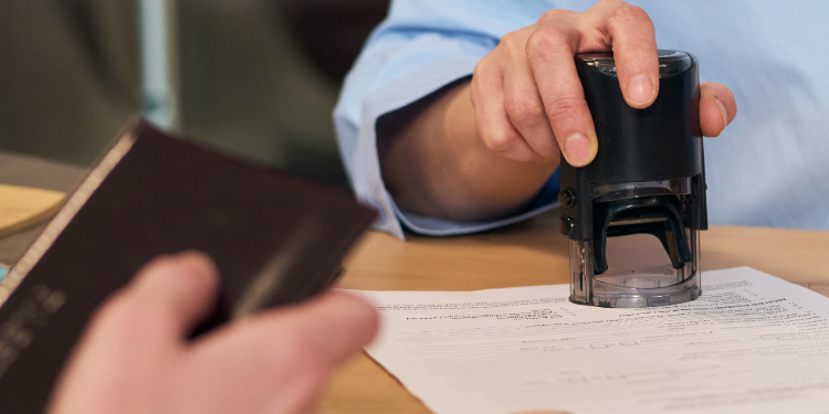 woman stamping documents