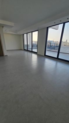 Sunny and Modern Floor for rent in Abu Fatira with Spacious Terrace