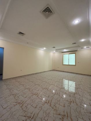 For rent, an apartment in Al Zahraa. Large area with a balcony.