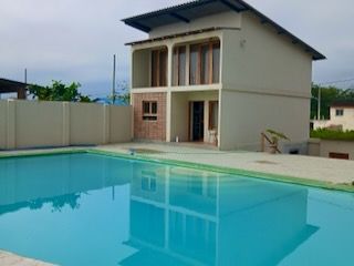 Oceanfront property with pool, apartment, and pergola in Manglaralto