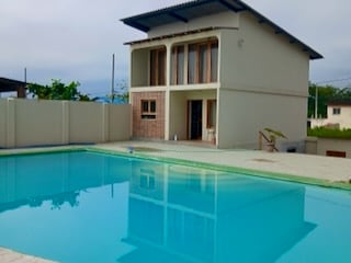 Oceanfront property with pool, apartment, and pergola in Manglaralto