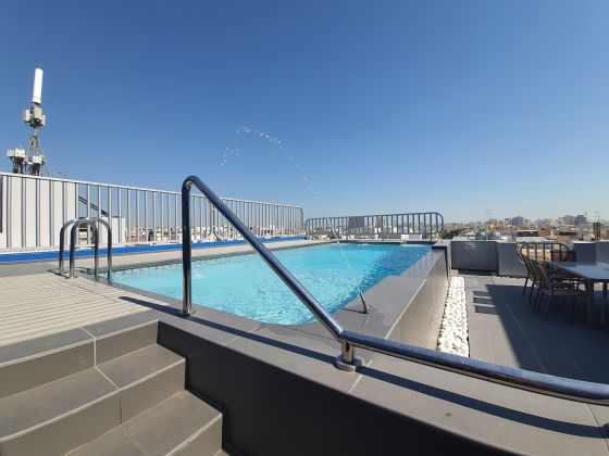 Modern One-Bedroom Apartment with Pool View