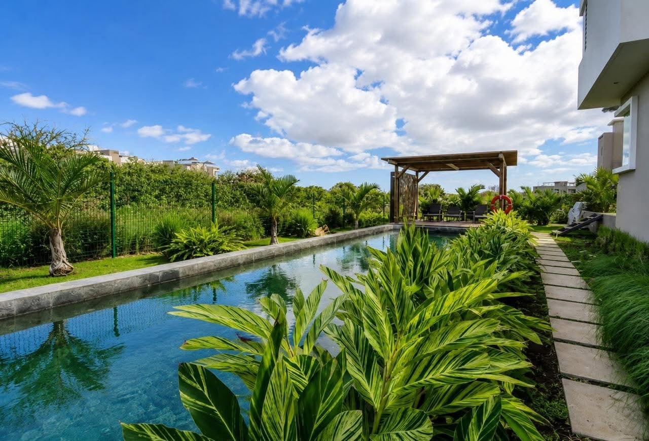 secure gated residence, offering comfortable family living just minutes from the beach and all amenities.